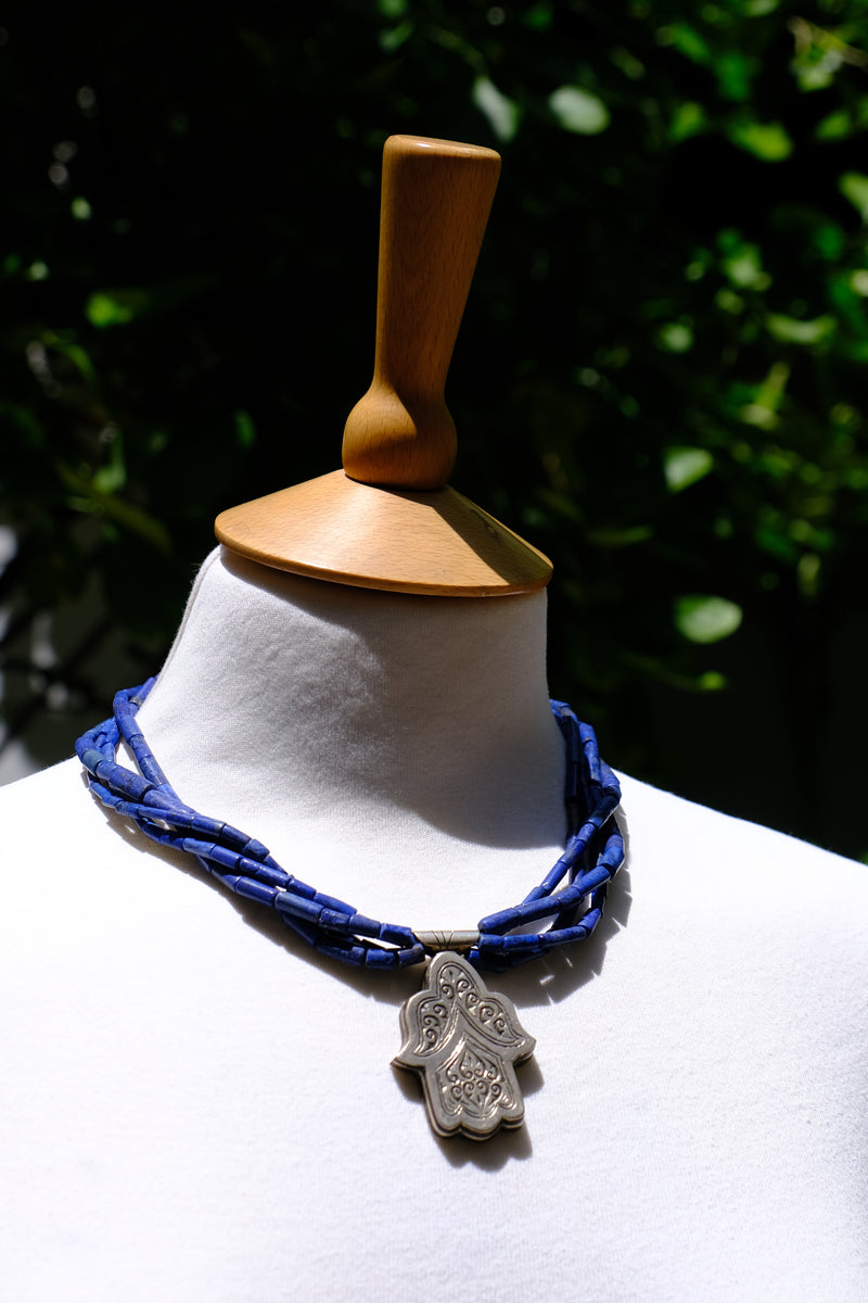 Lapis and silver hamsa necklace worn