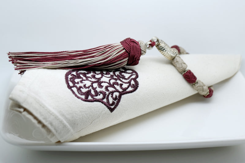 SET OF SIX DARK RED & BEIGE EMBROIDERED NAPKINS AND TASSEL RINGS