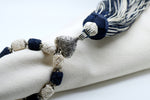 SET OF SIX NAVY BLUE & CREAM BUTTONED NAPKINS AND TASSEL RINGS