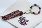 SET OF SIX DARK RED & BEIGE EMBROIDERED NAPKINS AND TASSEL RINGS
