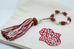 SET OF FOUR BRIGHT RED & CREAM  EMBROIDERED NAPKINS AND TASSEL RINGS