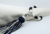 SET OF SIX NAVY BLUE & CREAM BUTTONED NAPKINS AND TASSEL RINGS